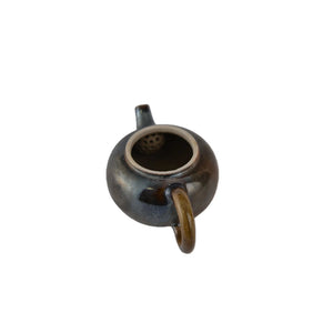 Interior view of PorSva No.63 wood-fired clay teapot showing natural unglazed interior