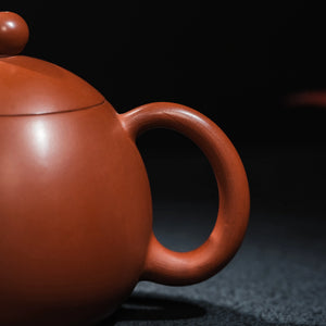 Curved handle detail of Jianshui Dragon Egg teapot