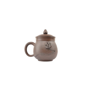 Handmade Jianshui Zitao pottery office mug featuring Bodhi texture and lotus pod relief decoration, unglazed clay surface