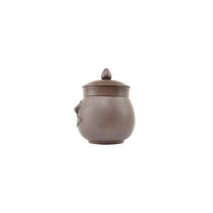 Front view of Jianshui Zitao pottery office mug showing lotus pod relief and handcrafted Bodhi texture