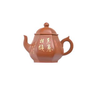 Left side view of PorSva No.54 hexagonal red clay teapot featuring carved Chinese calligraphy with clay inlay