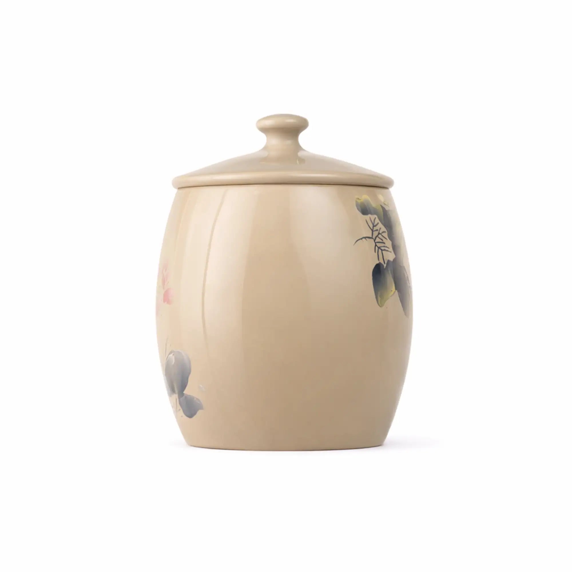 Side view of a handmade unglazed pottery tea canister with a burnished finish and hand-carved lotus design.