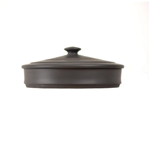 Side view of a handmade pottery tea cake storage box with a jump-cut textured band and fitted lid, designed for storing compressed tea cakes.