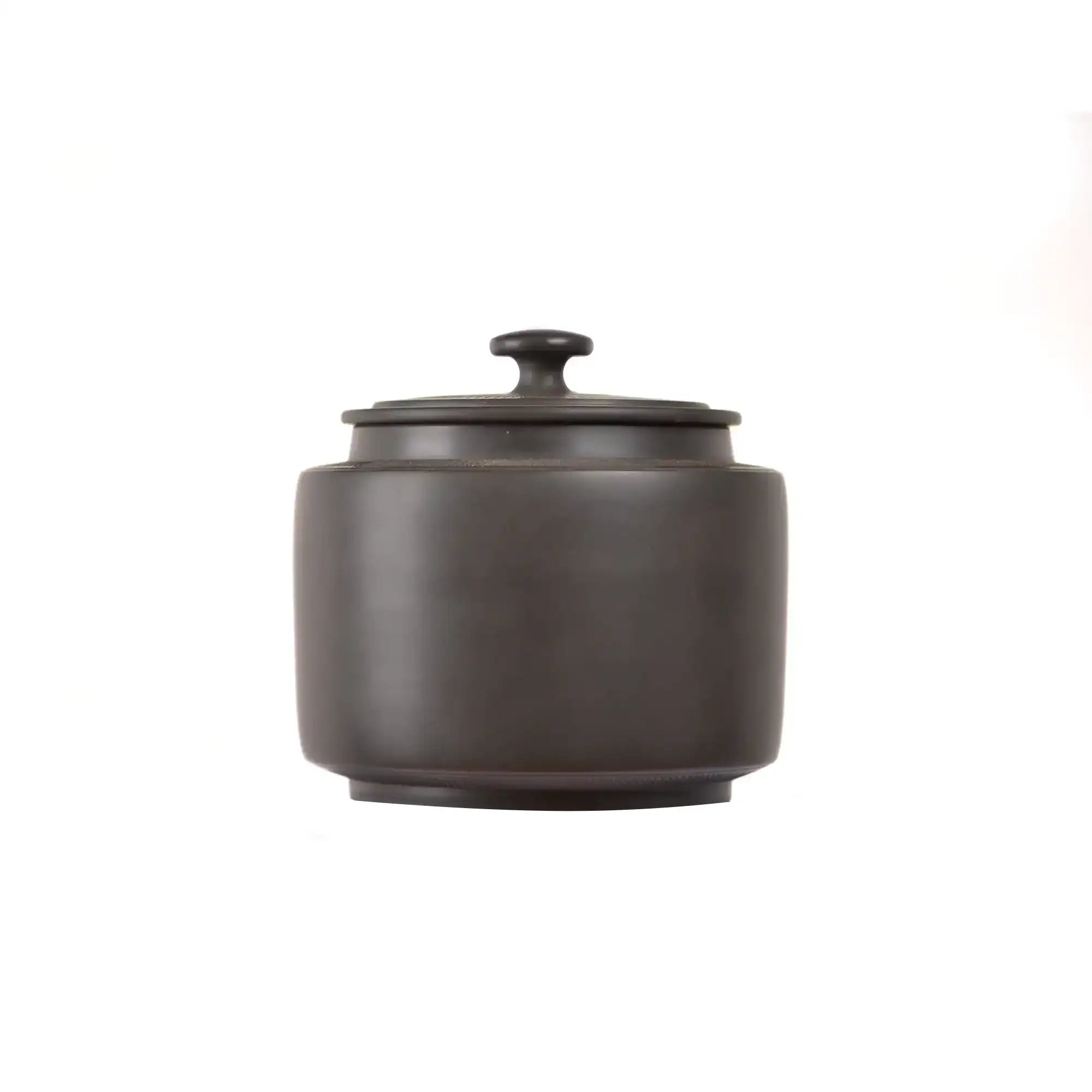 Back view of a Jianshui zitao tea canister with a smooth unglazed dark clay surface and minimalist form