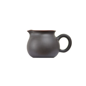 Side view of a Jianshui zitao fairness pitcher (gongdao cup) showing its smooth unglazed surface and rounded form