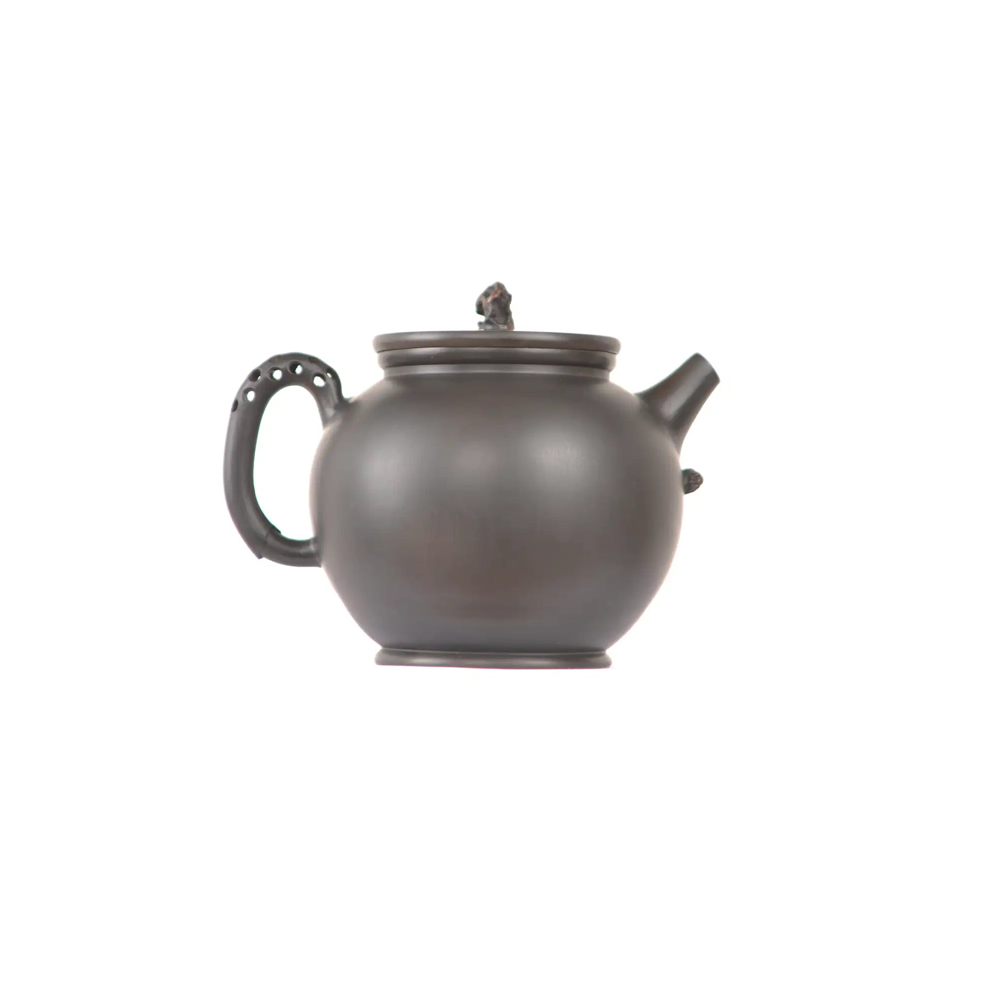 Jianshui zitao black clay teapot featuring a perforated handle design, side view.