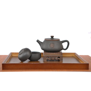 Handmade pottery Shi Piao peony tea set displayed on a wooden tray, featuring a teapot and two matching tea cups.