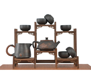 Handmade pottery Shi Piao peony tea set with six tea cups and one fairness pitcher, displayed on a tiered wooden stand.