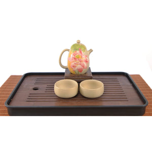 Handcrafted white clay lotus teapot set with two matching cups, featuring a hand-carved floral design.