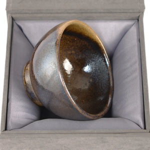 Jianshui zitao wood-fired cup presented on a gift box, emphasizing its natural kiln-fired character