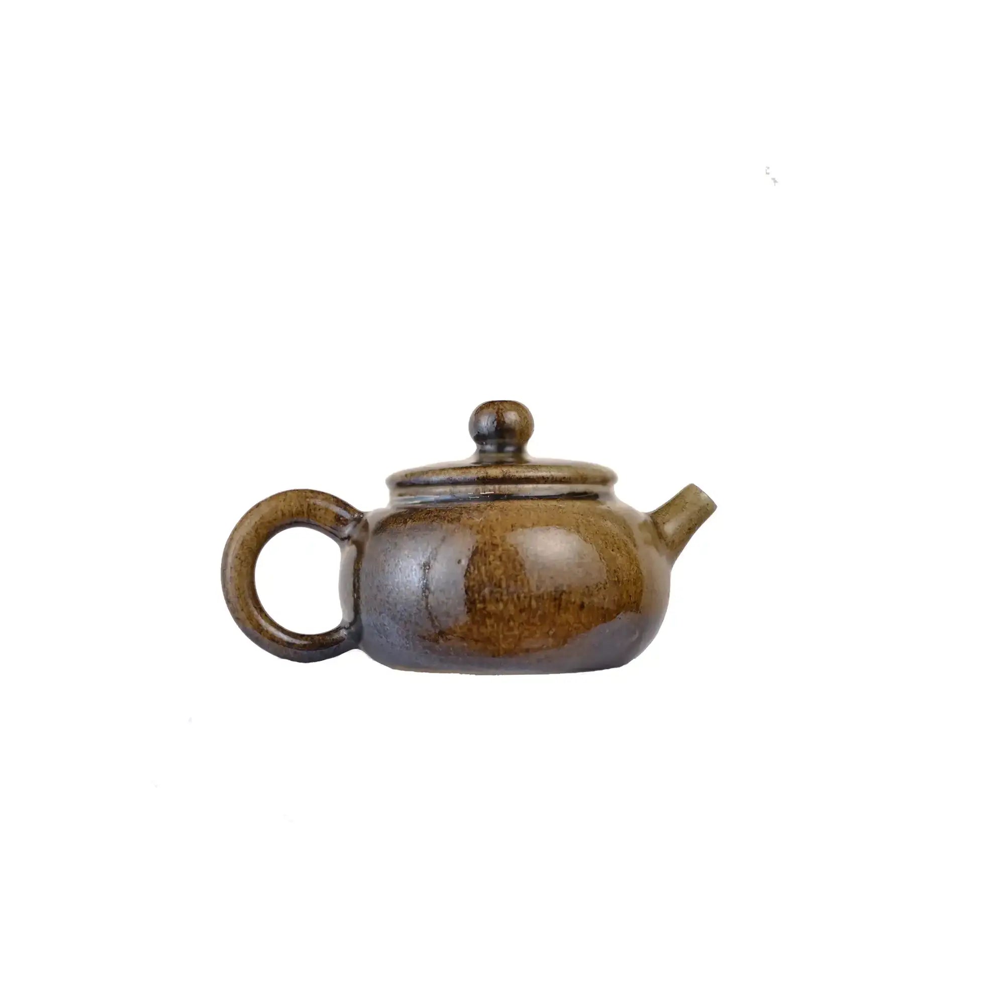 Jianshui zitao wood-fired teapot featuring mist-like surface layers shaped by flame and ash, side view.