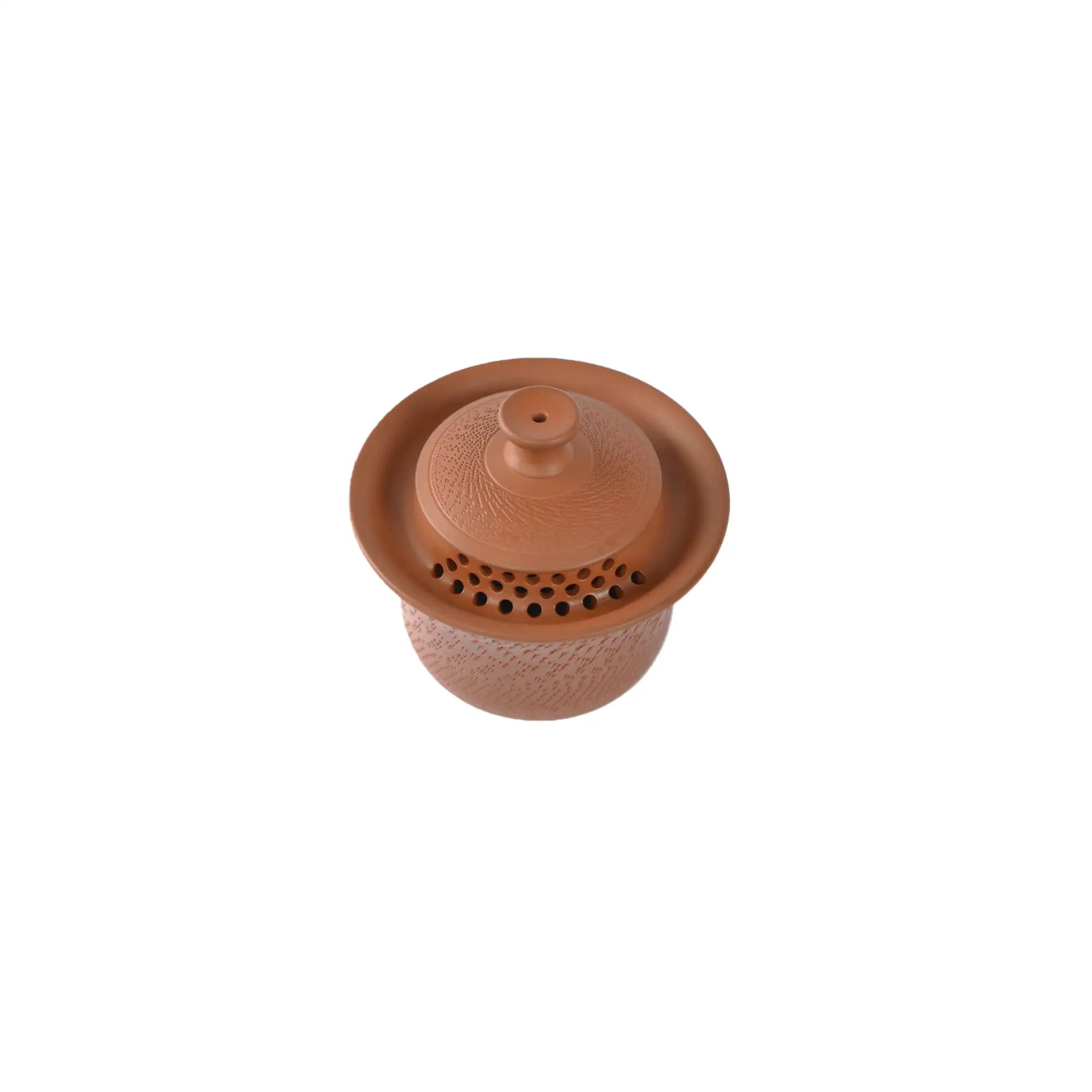 Top view of an unglazed red clay gaiwan with a jump-cut textured surface and a built-in filter hole lid, highlighting traditional handmade craftsmanship.