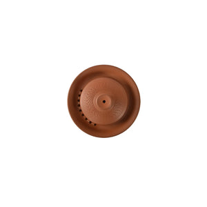 Top view of a Jianshui zitao red clay gaiwan with a jumping-knife textured surface and a lid with filter holes