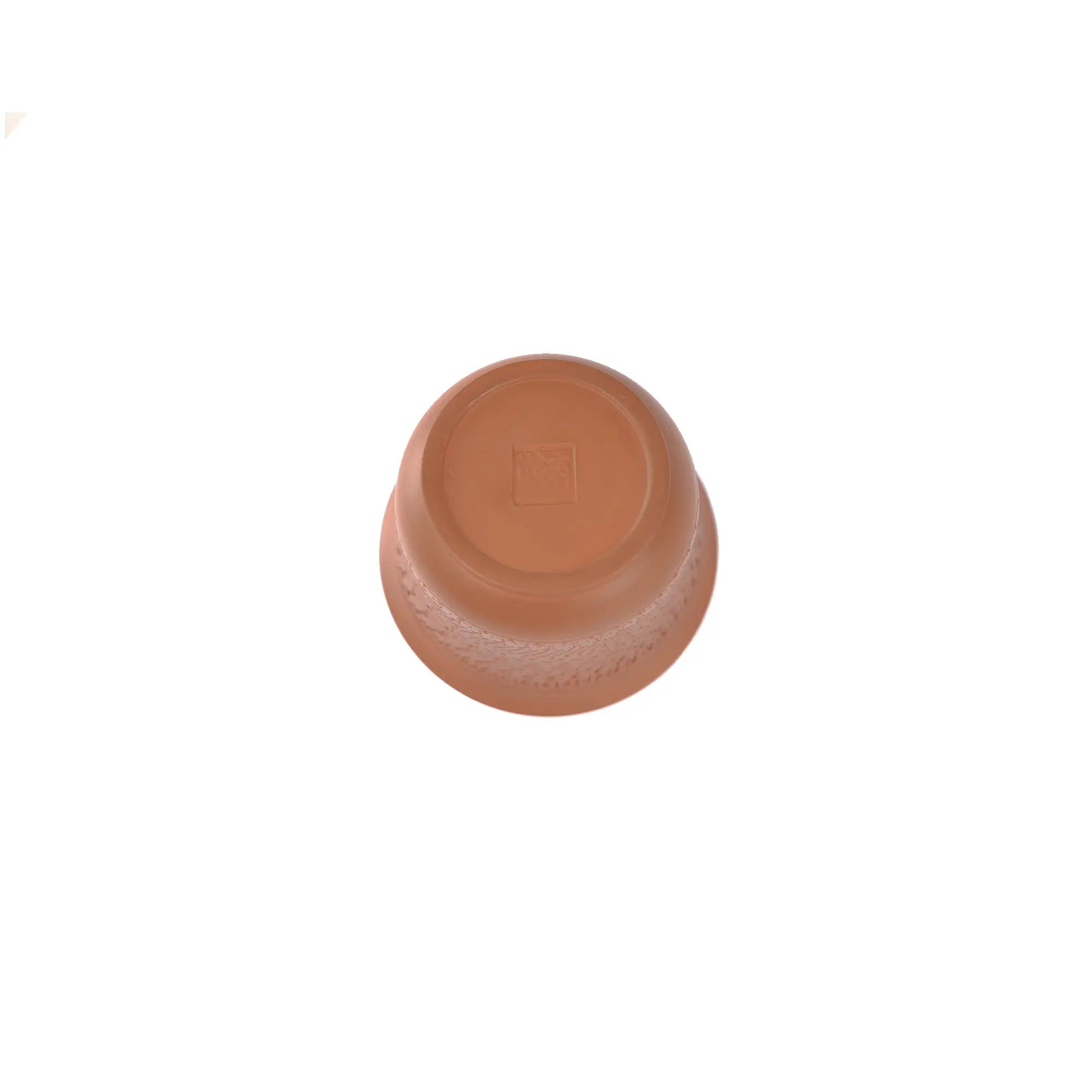 Bottom view of a Jianshui zitao red clay gaiwan with a hand-impressed seal and natural hand-finishing traces