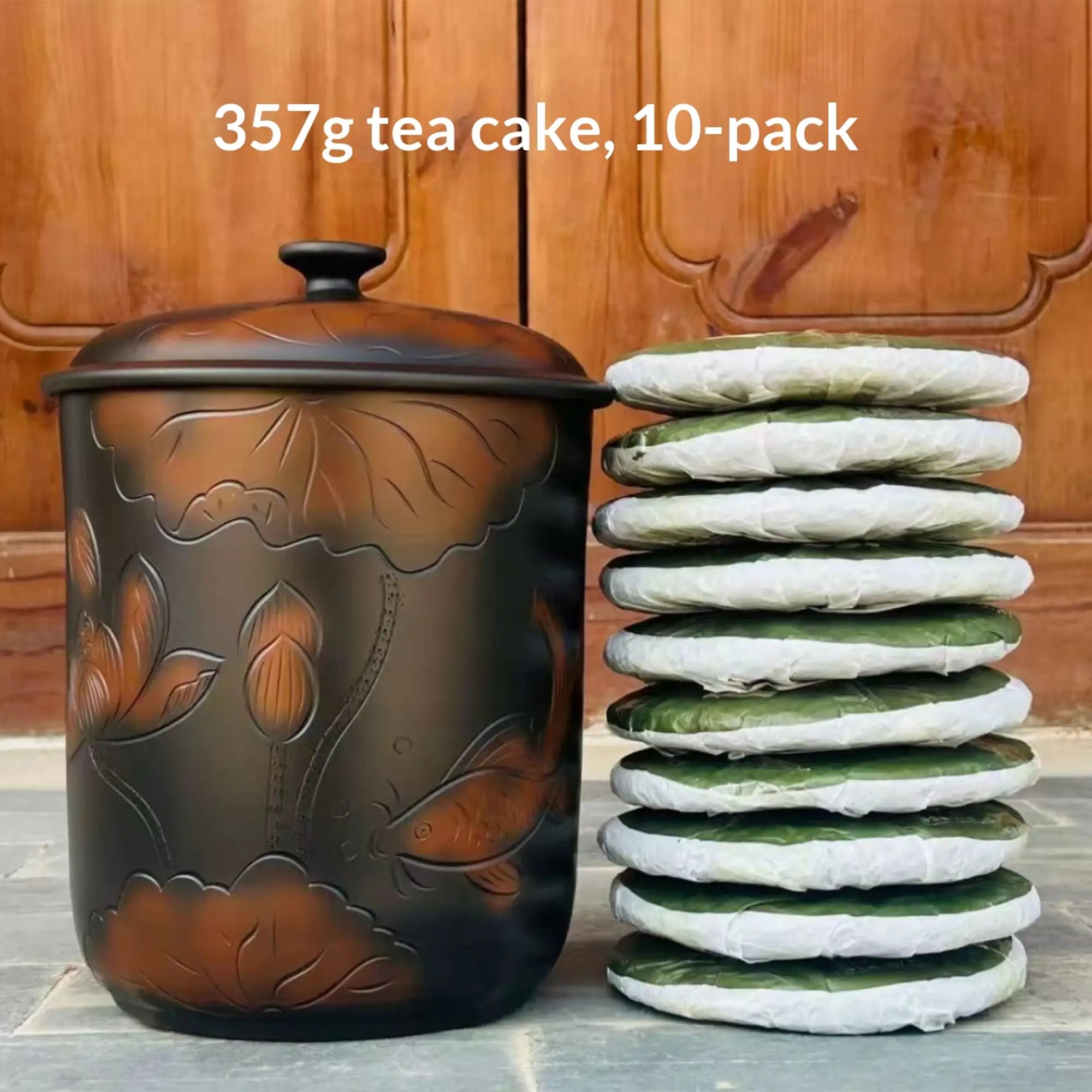 Jianshui zitao line-engraved storage jar displayed with a tea cake storage example using 357g cakes