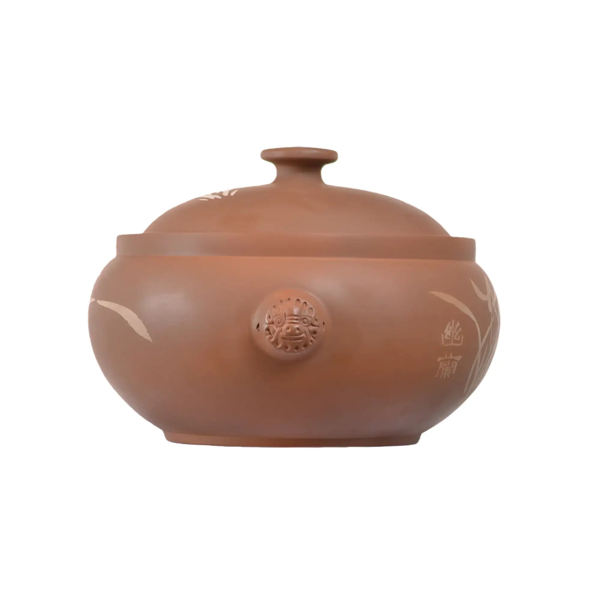 Rear view of a handmade purple pottery steam pot (red clay) with rounded form and fitted lid.