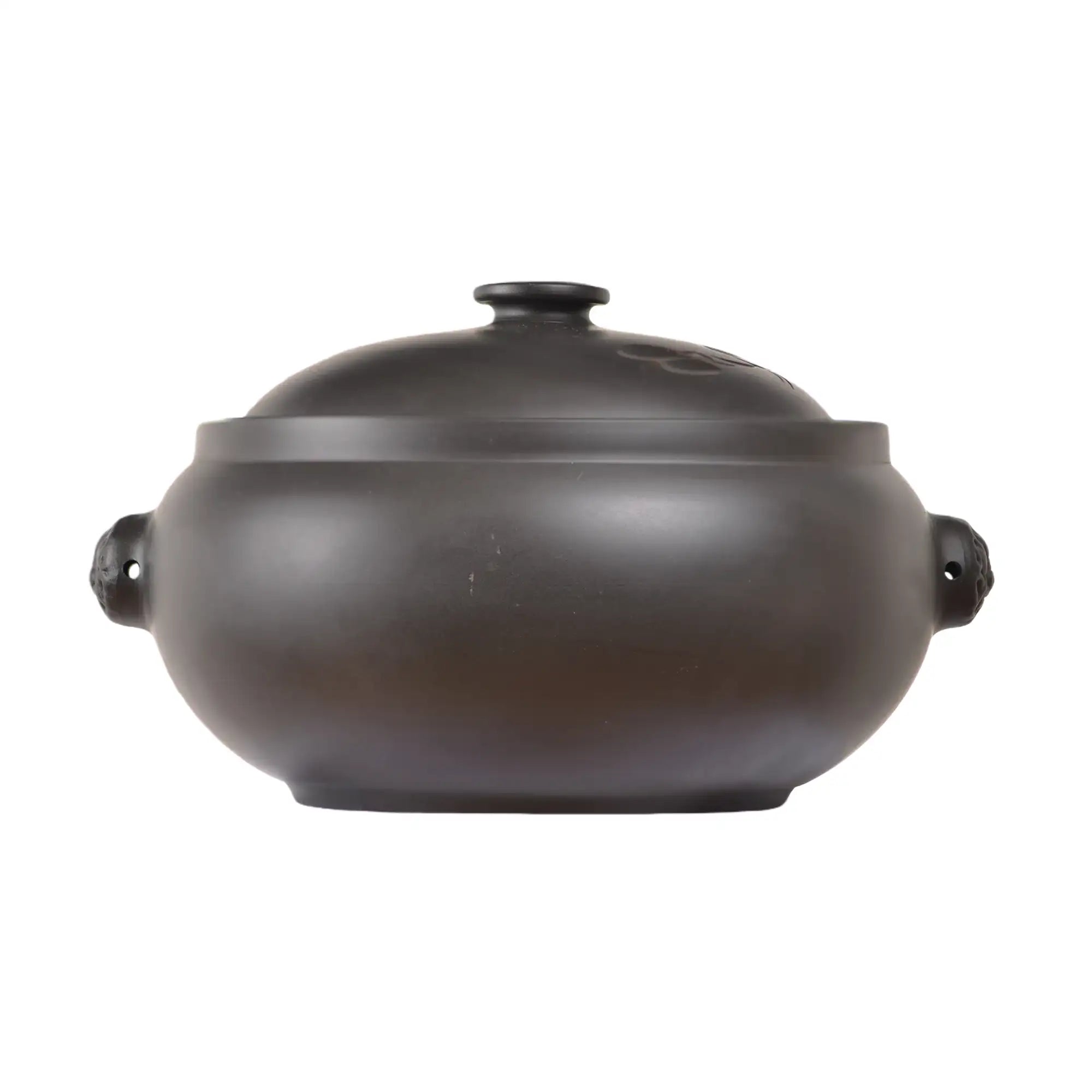 Back view of a Jianshui zitao pottery steam pot with a smooth rounded body and fitted lid