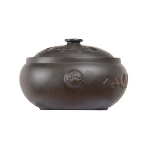 Jianshui zitao pottery steam pot with subtle line-carved lotus decoration and rounded form
