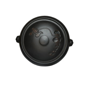 Top view of a Jianshui zitao pottery steam pot showing the lid and side handles