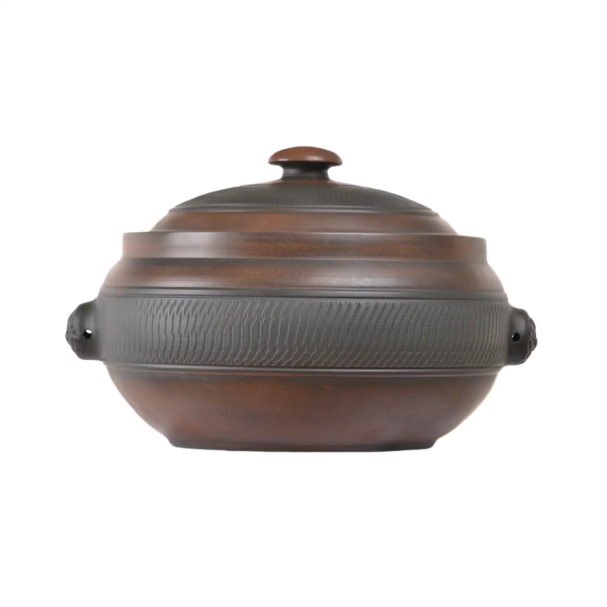 Handmade pottery steam pot with a chattering-carved texture and fitted lid.