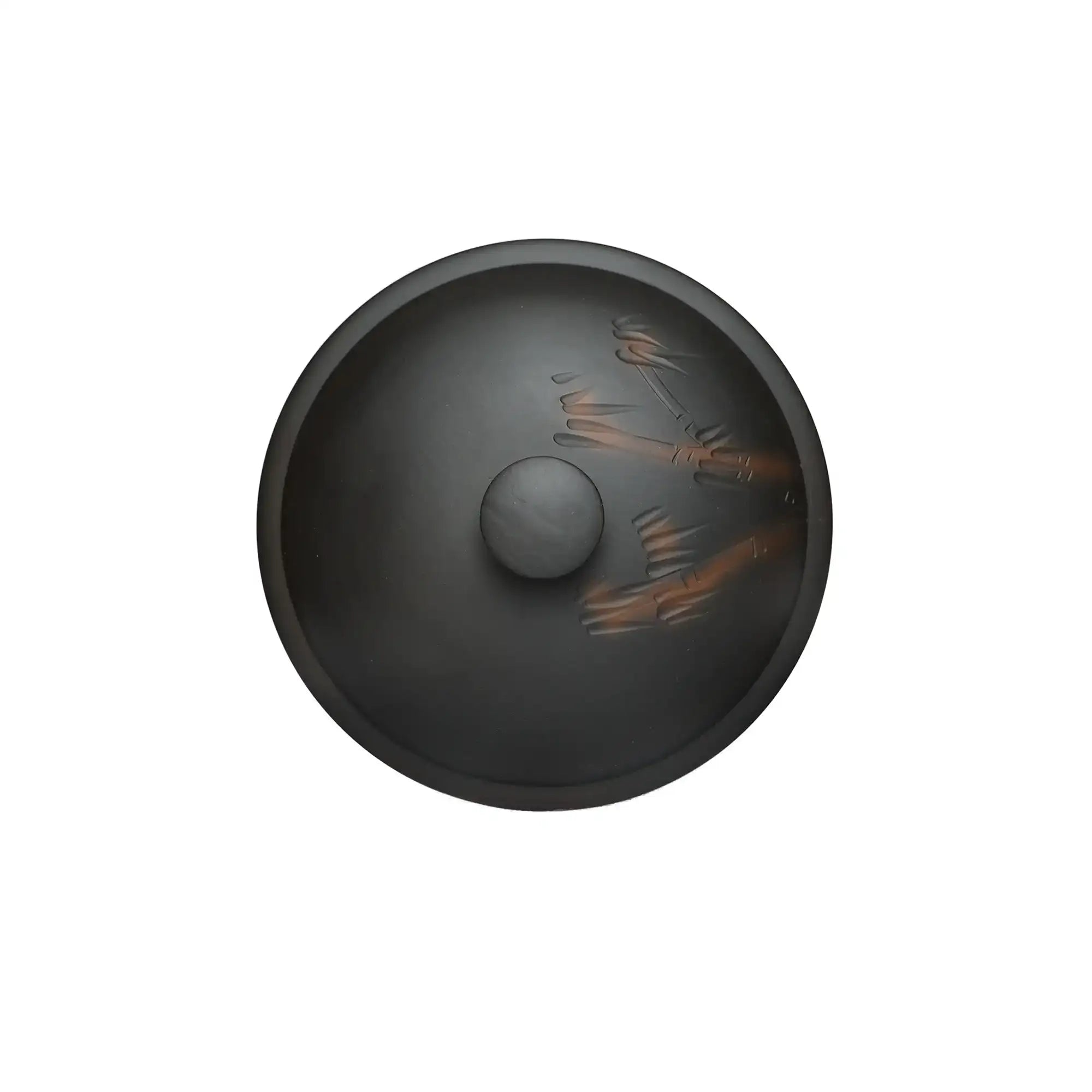 Top view of a Jianshui zitao (black) tea canister with hand-carved bamboo design on the lid