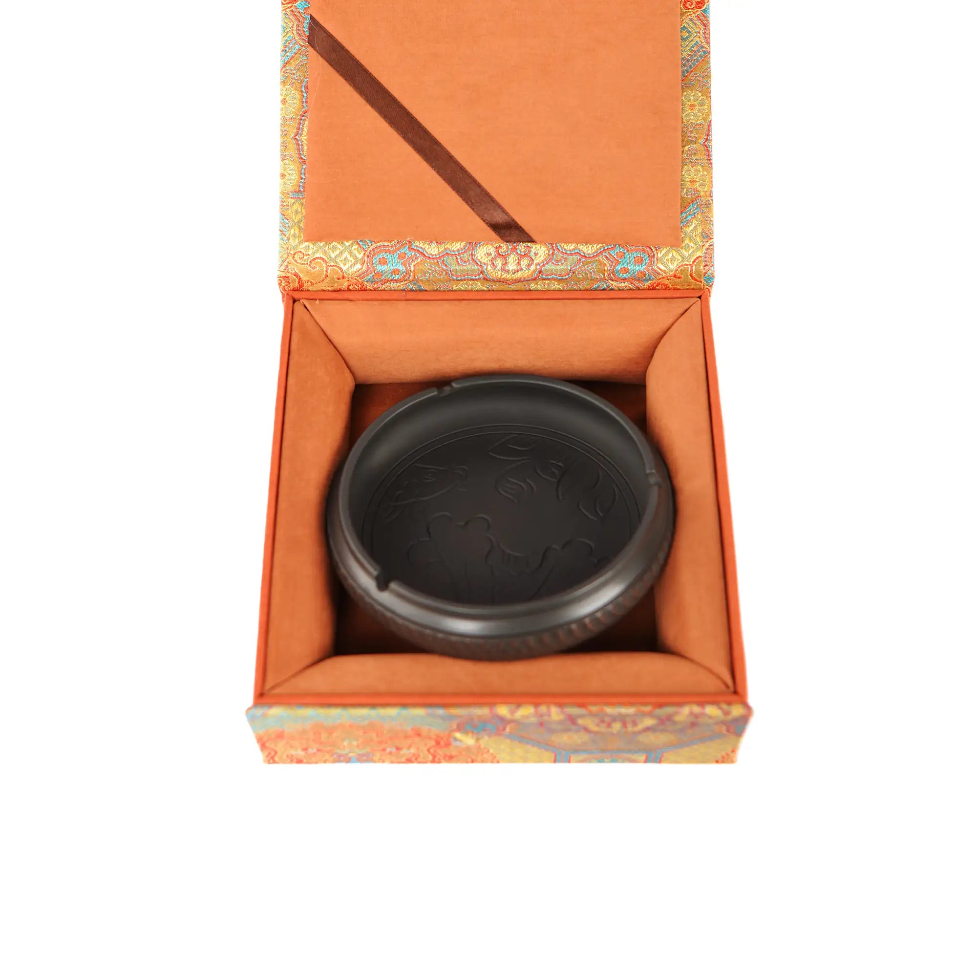 Handmade pottery ashtray with carved lotus leaf and fish design, presented in a decorative gift box