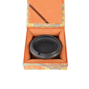Top view of a handmade pottery ashtray featuring fish and lotus leaf motif, displayed inside a gift box