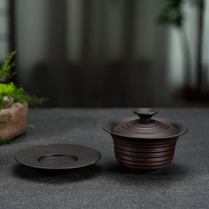 Handmade Jianshui rustic gaiwan displayed in a tea setting