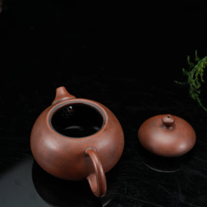 Jianshui red clay teapot with lid removed showing the opening