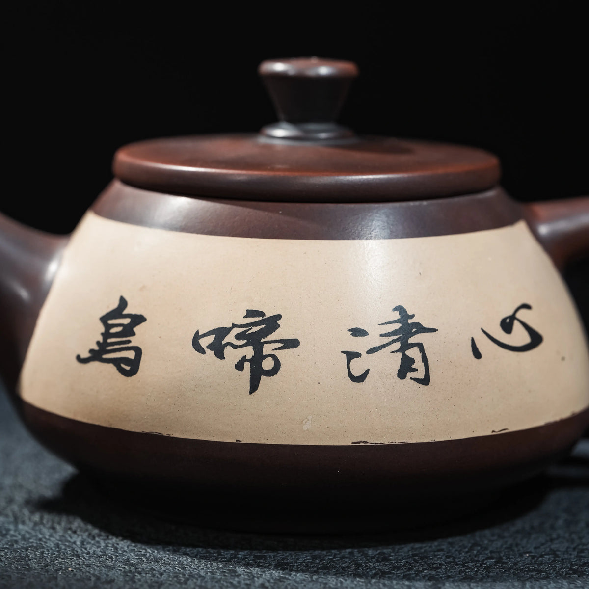 Side view of Jianshui teapot with framed inlay decoration