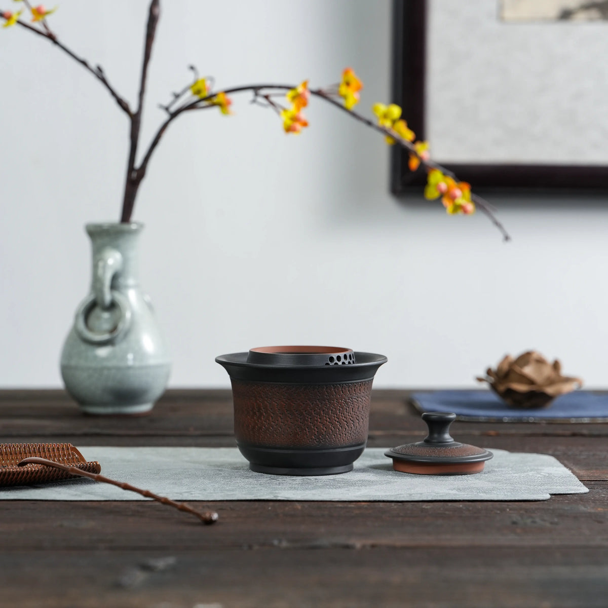 Side view of Jianshui black chattering handleless teapot