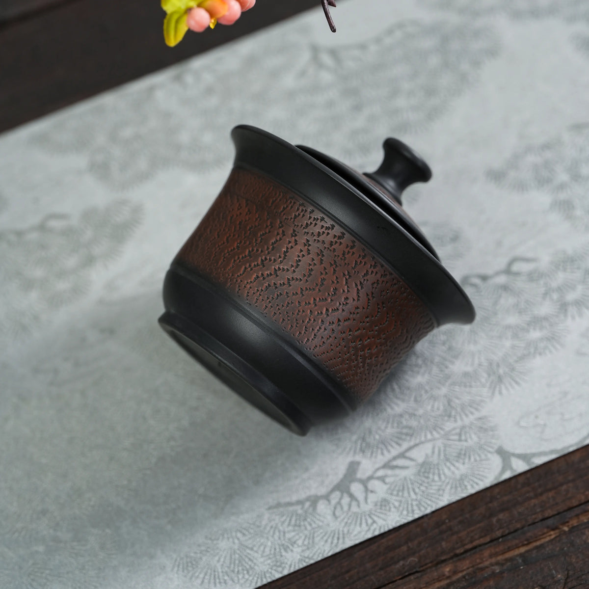 Close view of chattering texture on Jianshui black clay teapot