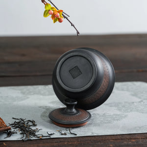 Bottom view of handmade Jianshui black handleless teapot