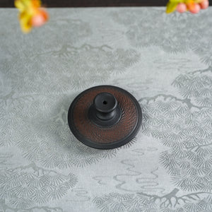 Top view of the lid on Jianshui black handleless teapot