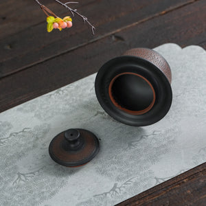 Jianshui black handleless teapot with lid removed showing the opening