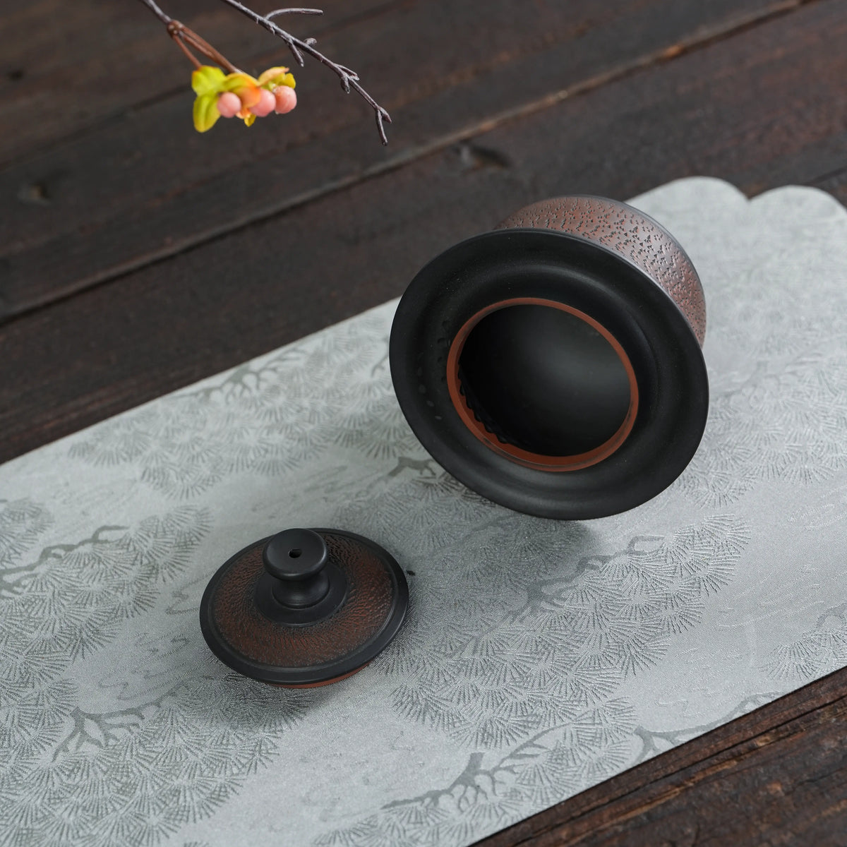 Jianshui black handleless teapot with lid removed showing the opening