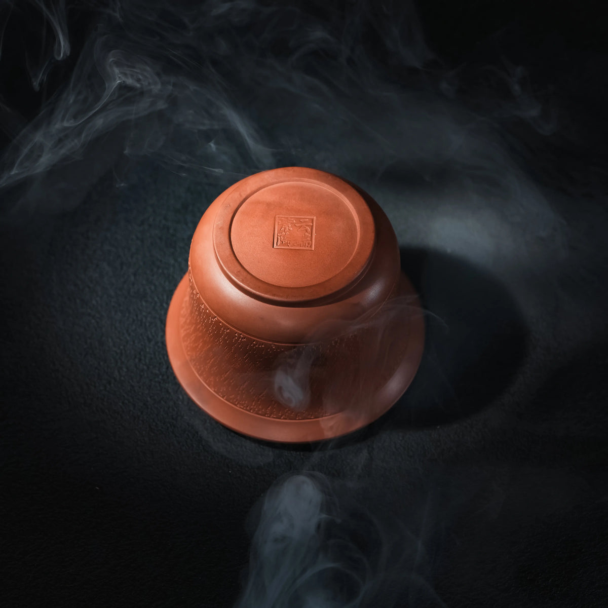 Bottom view of handmade Jianshui red clay handleless teapot