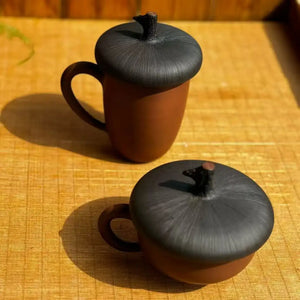 Handmade clay chestnut-shaped teacup, unglazed purple clay pottery