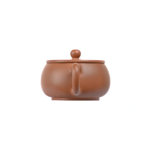 Back view of PorSva No.52 plain red  clay teapot emphasizing natural clay surface