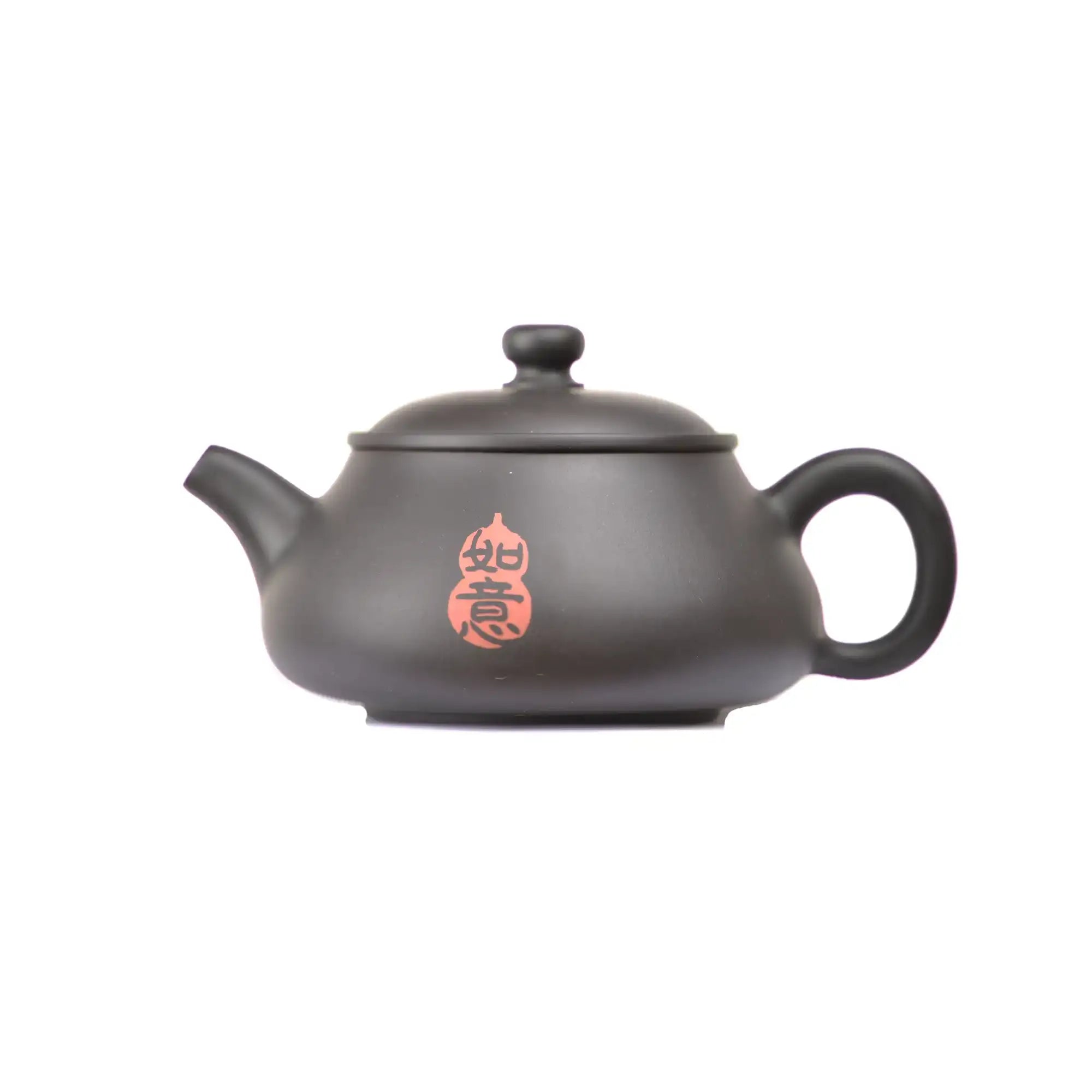 Side view of clay teapot No.26 featuring red calligraphy carving detail