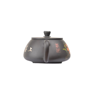 Back view of clay teapot No.27 featuring traditional yin carving and yang inlay decoration