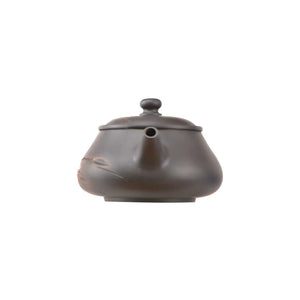 Clay teapot No.4 showing hand-carved bamboo motif and natural clay texture
