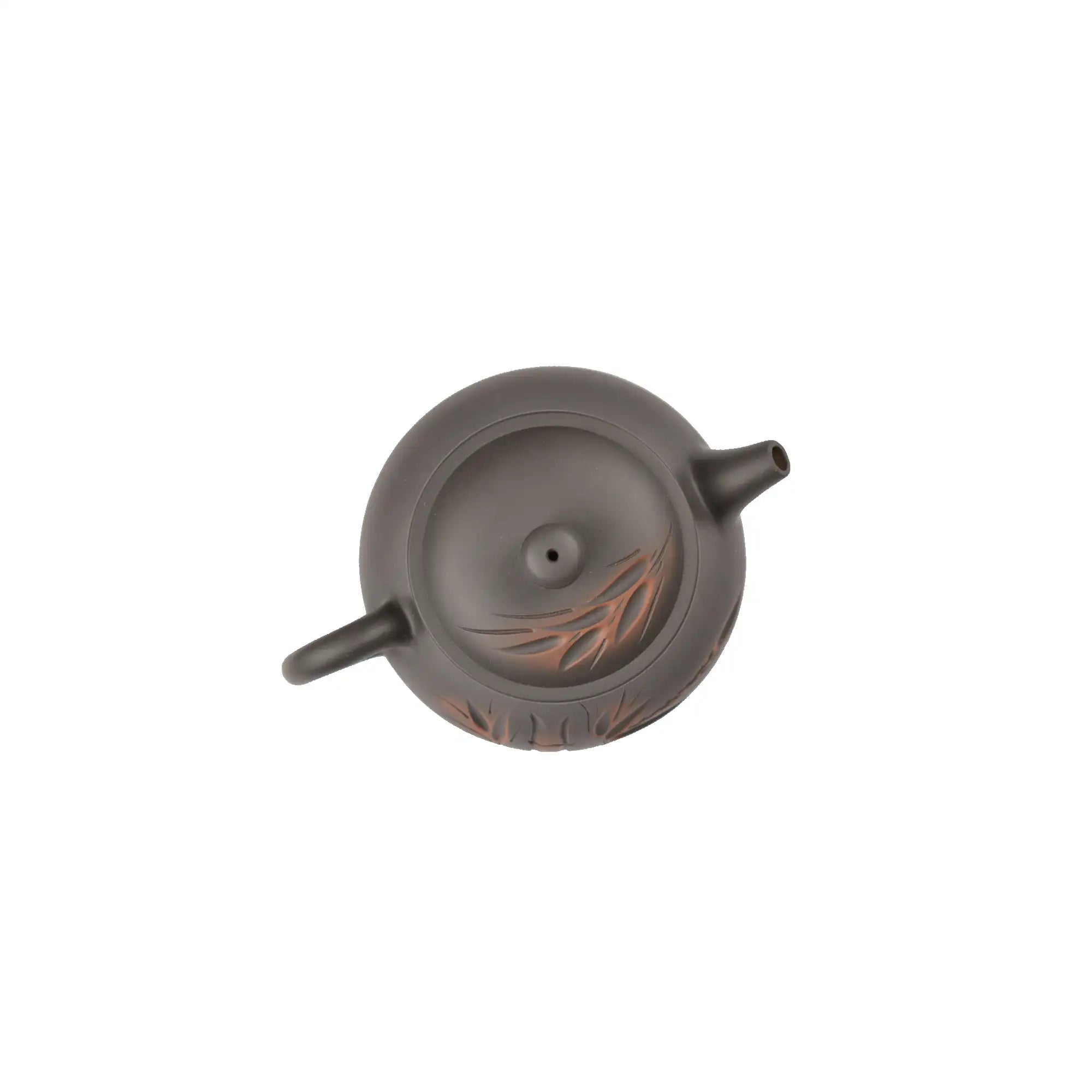 Top view of clay teapot No.4 highlighting lid shape and carved bamboo design