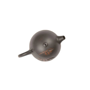 Top view of clay teapot No.6 highlighting lid shape and bamboo carved design