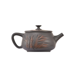 ide view of clay teapot No.8 featuring hand-carved bamboo design and traditional form