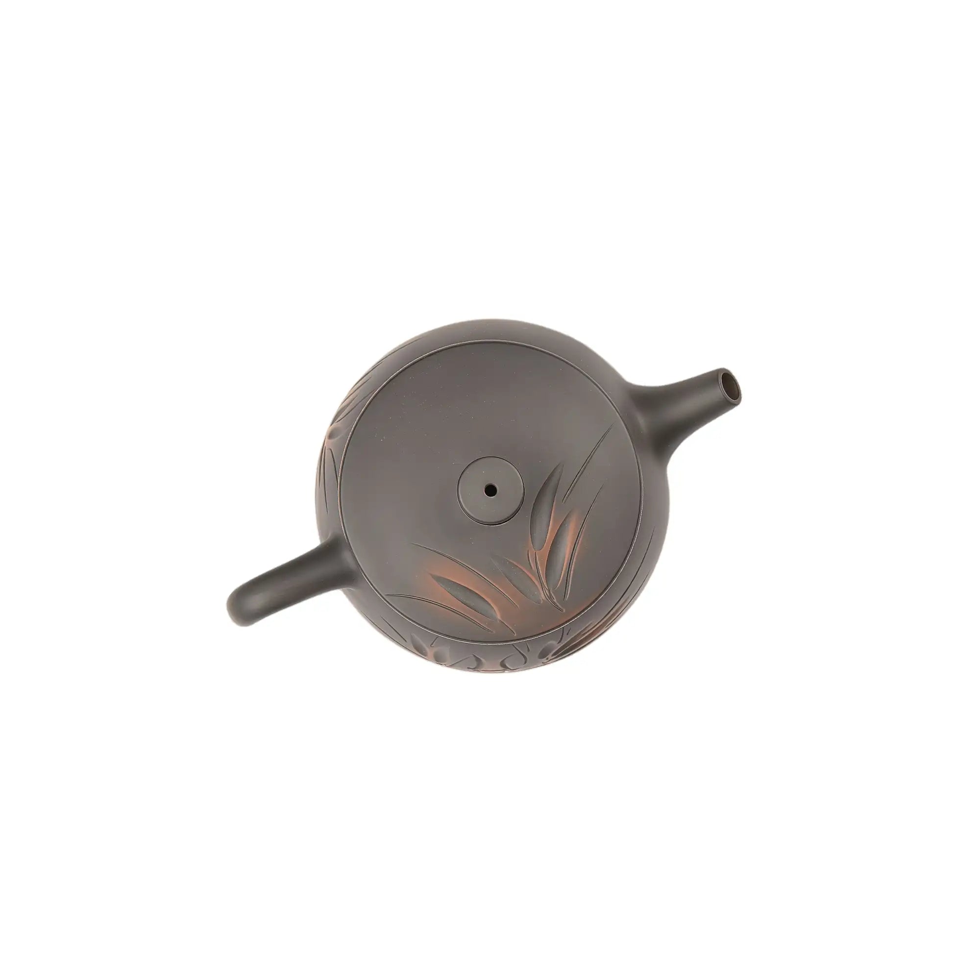 Top view of clay teapot No.8 highlighting lid shape and bamboo carved design