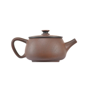 Alternate side view of clay teapot No.10 featuring Bodhi pattern detailing