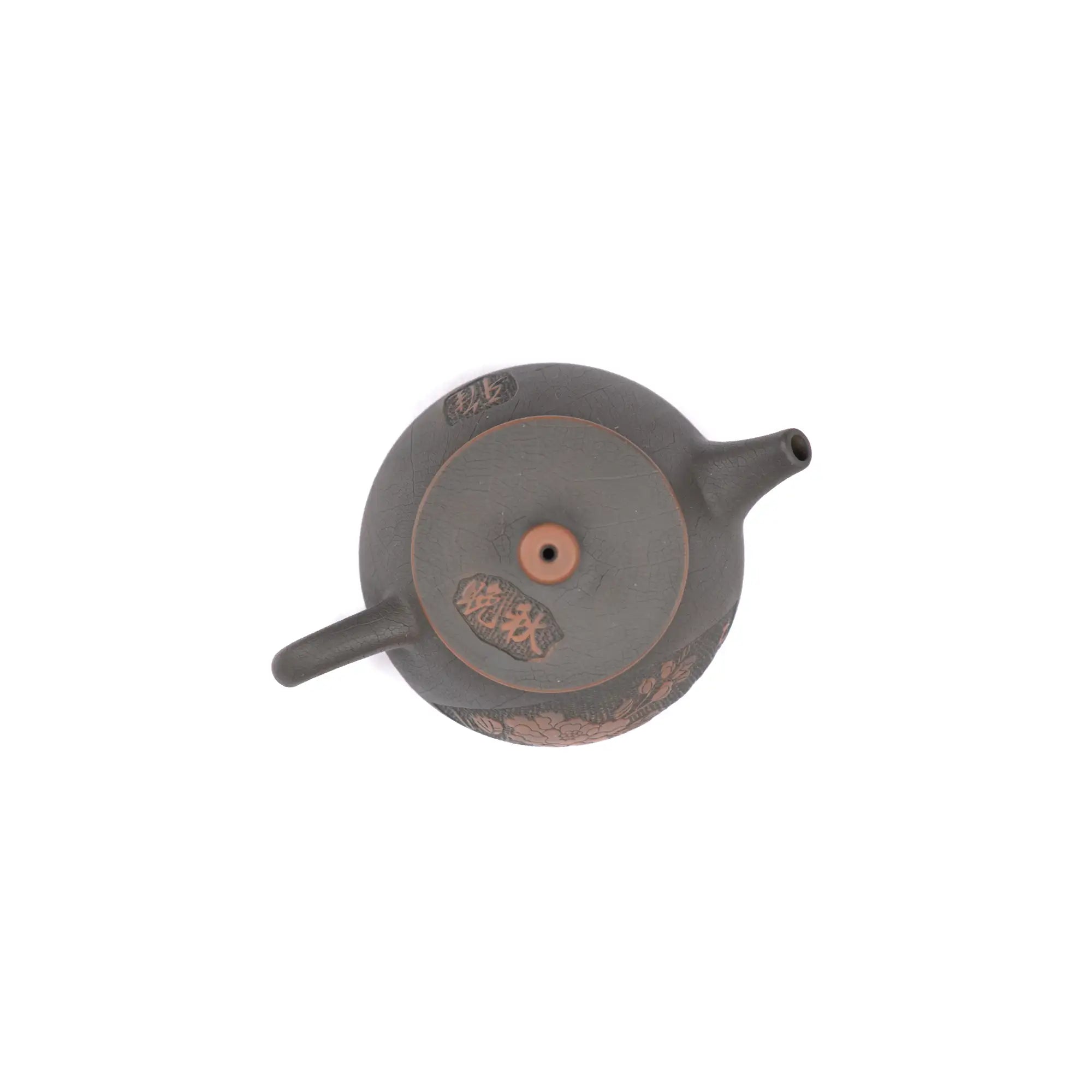 Top view of clay teapot No.23 highlighting lid shape and peony relief detail