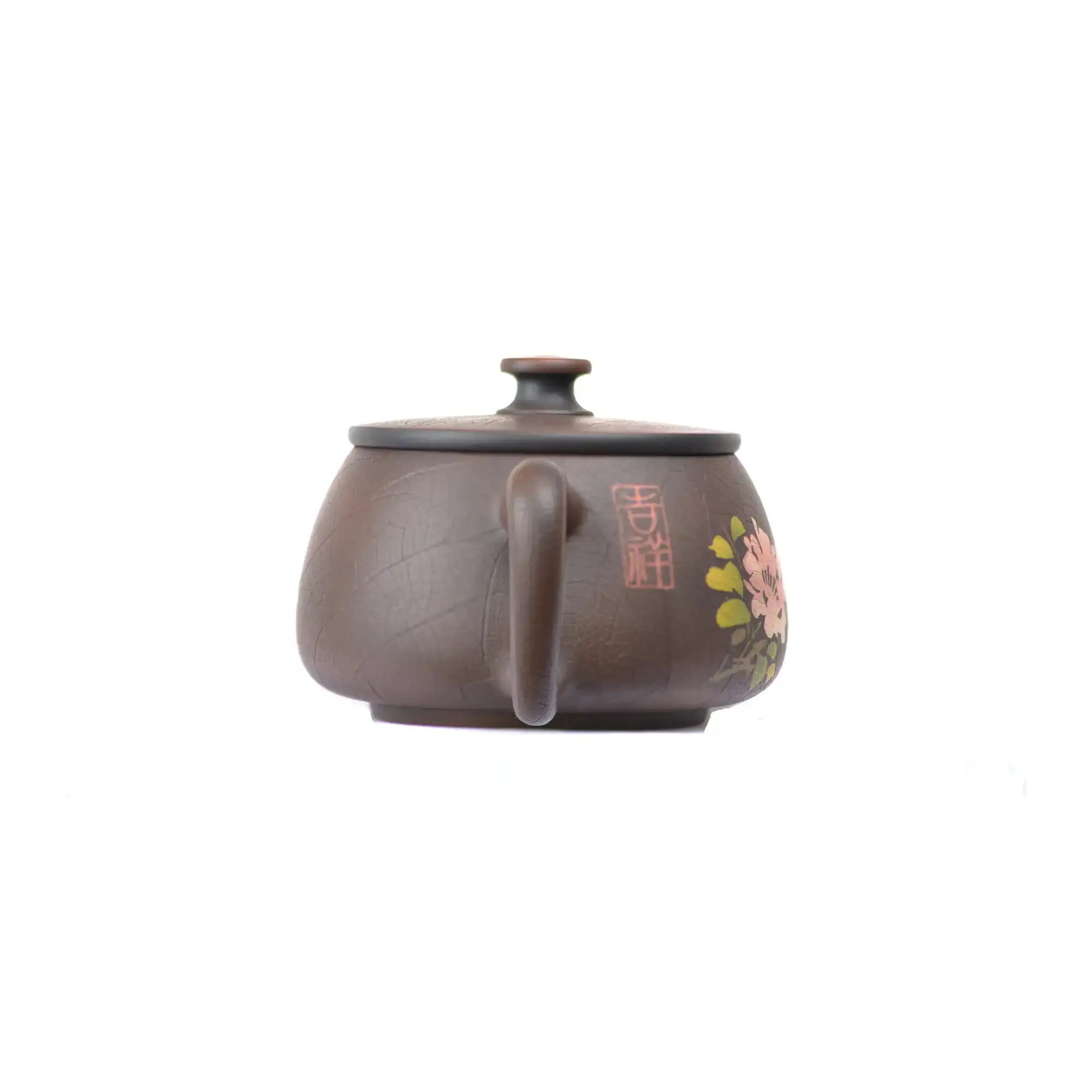 Back view of clay teapot No.28 featuring traditional inlay decoration