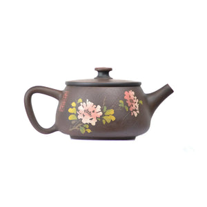 Side view of clay teapot No.28 showing Bodhi pattern texture and yin-carved peony motif